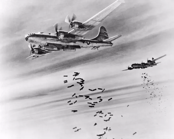 Burma:  February 28, 1945 Bombs cascade from the bomb bay doors of B-29 Superfortresses during a raid on the Japanese supply depots near the Mingaladon Air Field.