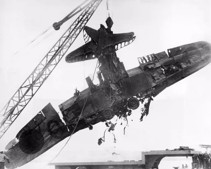 Pearl Harbor, Hawaii:   January 7, 1942 The wreckage of a Japanese torpedo plane shot down during the surprise attack on December 7 being salvaged from the bottom of Pearl Harbor.