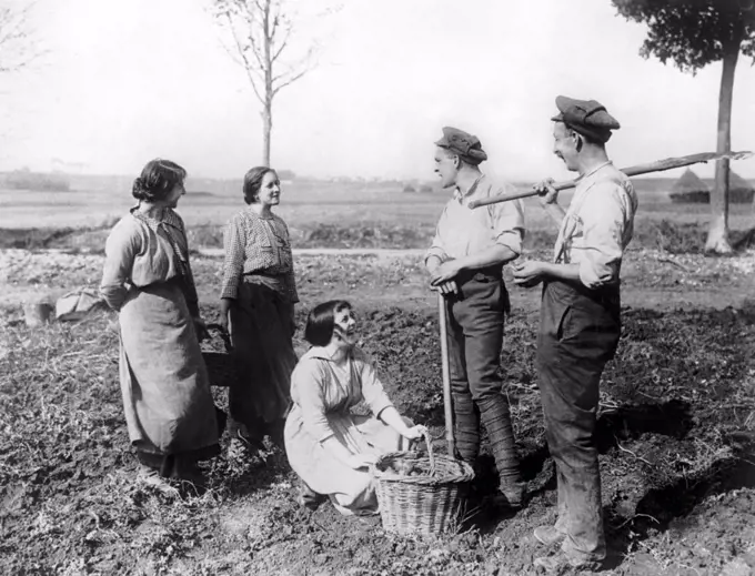 Canada:  c. 1915 A group of Canadian war workers of the land enjoying a moment of relaxation.