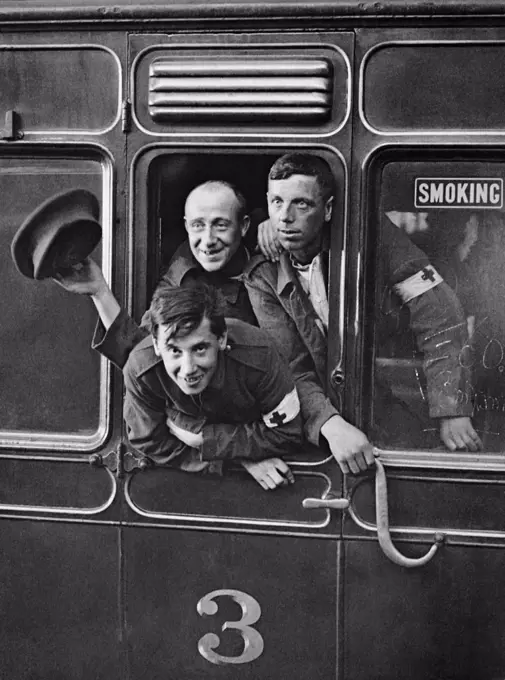 London, England:  June 30, 1915 Happy British prisoners return home from Germany at St. Pancras Station in London.