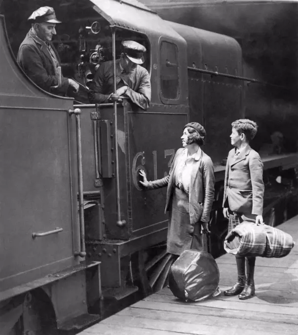 London, England: May 9, 1935 Two orphaned youngsters have traveled from Australia to England, and are now preparing to board the train at Euston Station that will take them to Scotland to live with an aunt.