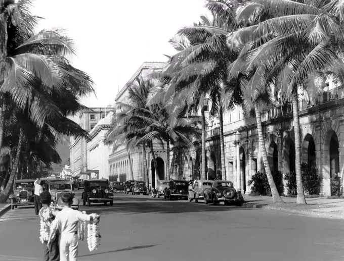 Honolulu, Hawaii:  October, 1945 Hawaii has asked the United Nations Organization to establish its permanent home on Oahu, a few miles away from Honolulu. Honolulu has complete cable, radio, radio to telephone, and telephoto facilities. Pictured is a street in modern downtown Honolulu