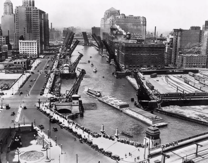 Chicago, Illinois:  1933 Barges from New Orleans arriving in Chicago on the Chicago River with Michigan Ave in the lower right corner.