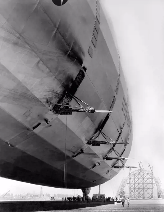 Mountain View, California, 1933 A U.S. Navy dirigible is at rest at Moffett Field. while Hangar One can be seeing under construction in the background.