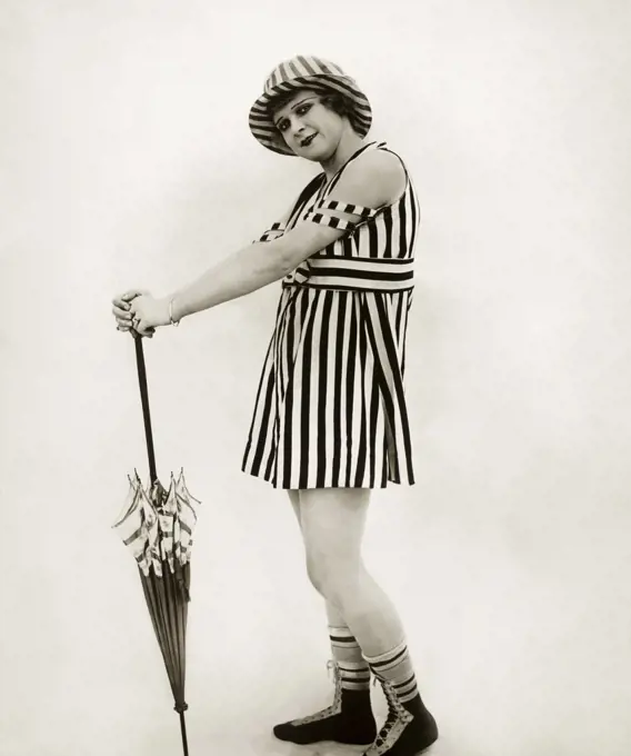 Portrait of a young woman holding an umbrella