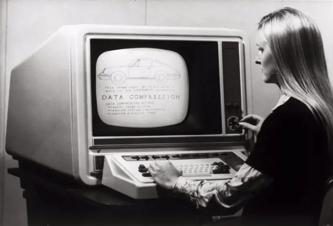 Side profile of a businesswoman working on a computer, Conographic-9 Terminal, 1975