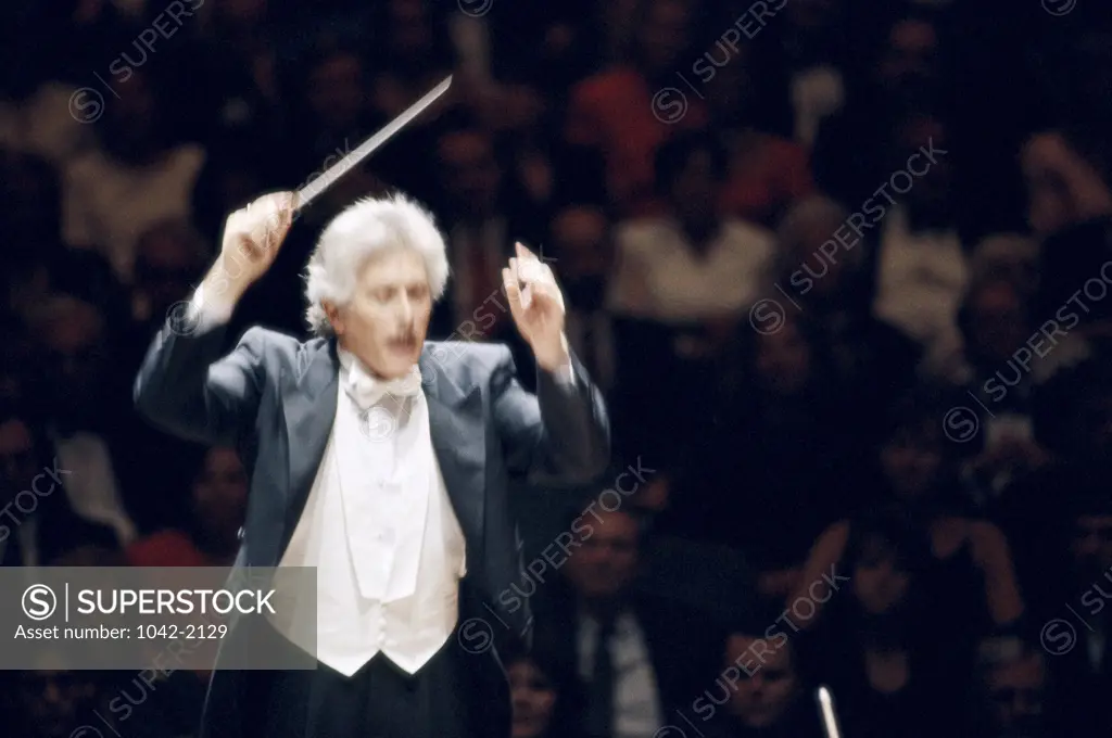 Conductor leading a symphony orchestra