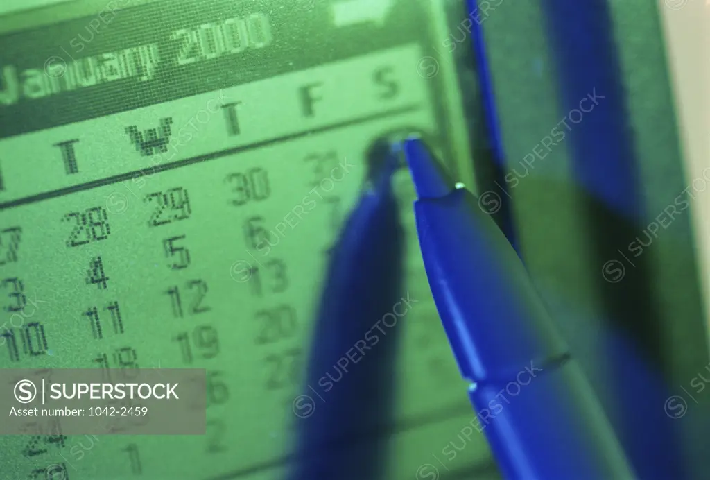 Close-up of a digitized pen on a digital calendar