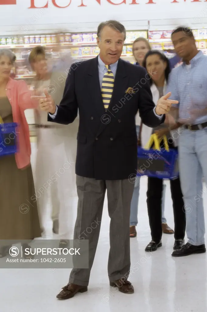 Portrait of a sales clerk standing in a supermarket