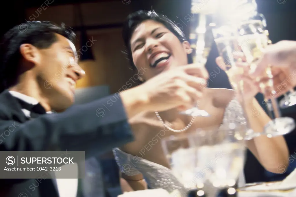 Newlywed couple celebrating with champagne