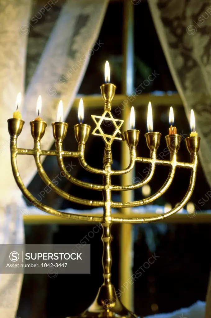 Close-up of lit candles on a menorah