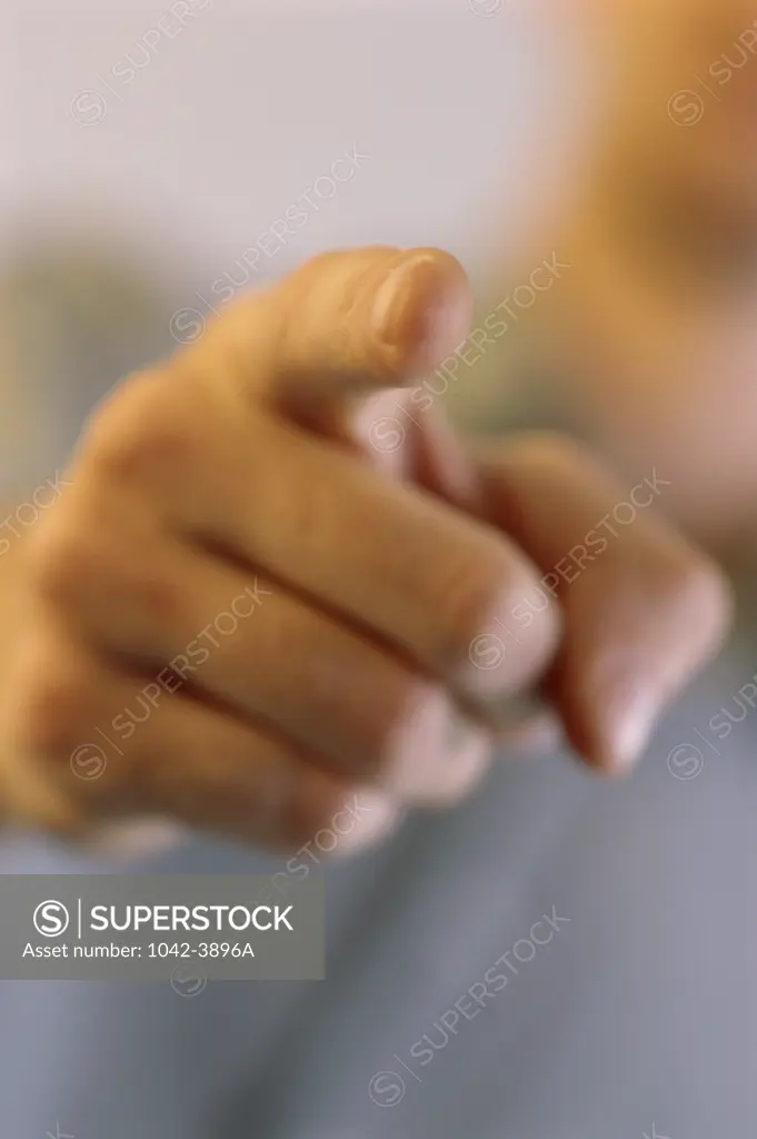 Close-up of a person pointing a finger