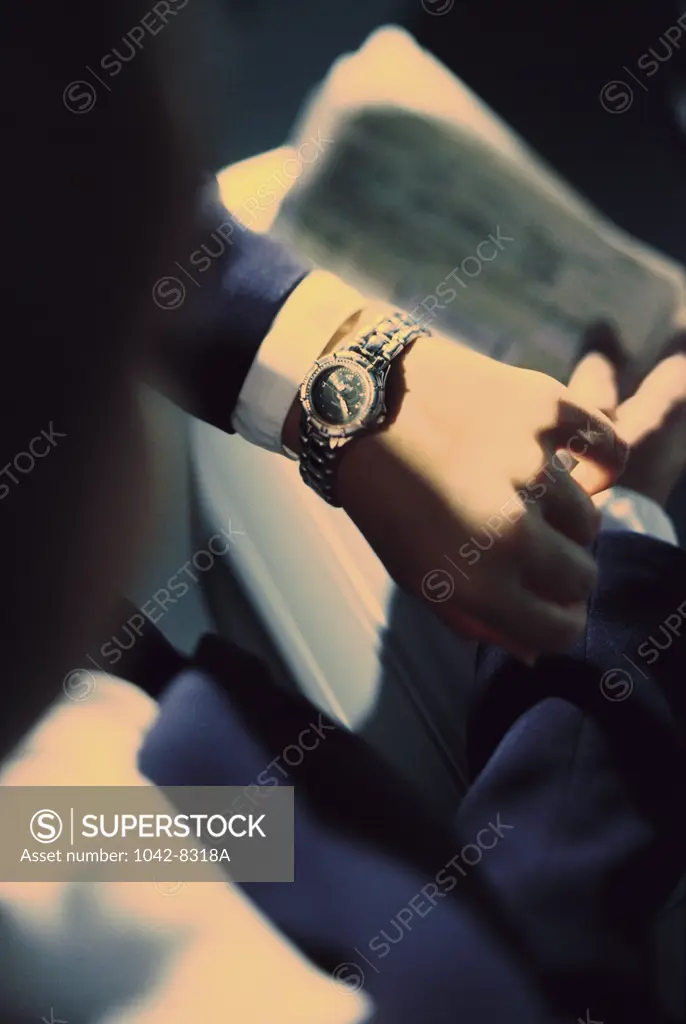 Person's hand wearing a wristwatch