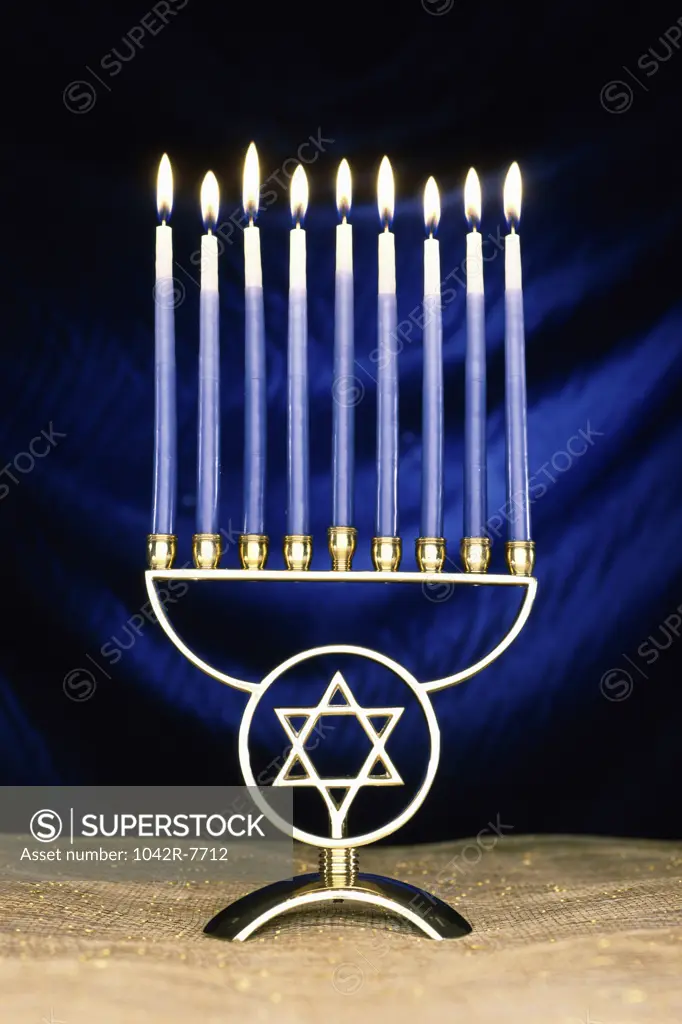 Lit candles on a menorah