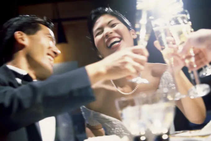 Newlywed couple celebrating with champagne