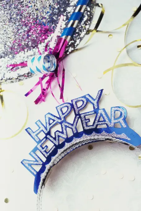 Sequined hat with a Happy New Year sign and streamers