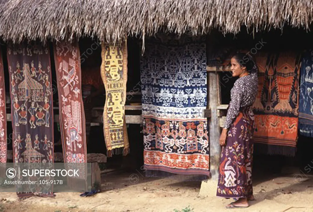 Woman showing Ikat weavings, Prailiu, Sumba, Indonesia