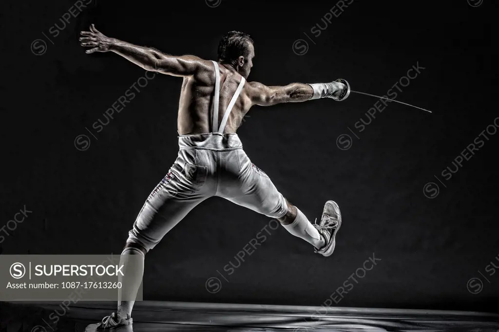 American World Champion and two time Olympic Fencer Soren Thompson against a dark background. Bodies in Action