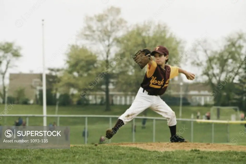 Teenage boy playing baseball