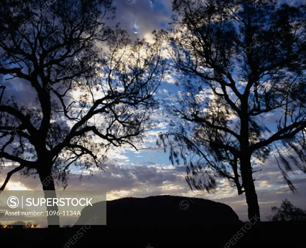 Silhouette of a rock formation at dusk, Ayers Rock, Uluru-Kata Tjuta National Park, Northern Territory, Australia