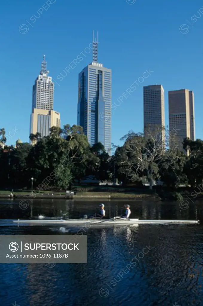 Two people canoeing in a river, Yarra River, Melbourne, Victoria, Australia