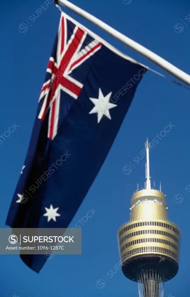 Low angle view of an Australian flag and a tower, Amp Tower, Sydney, New South Wales, Australia