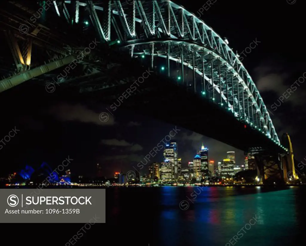 Low angle view of a bridge lit up at night, Sydney Harbor Bridge, Sydney, New South Wales, Australia