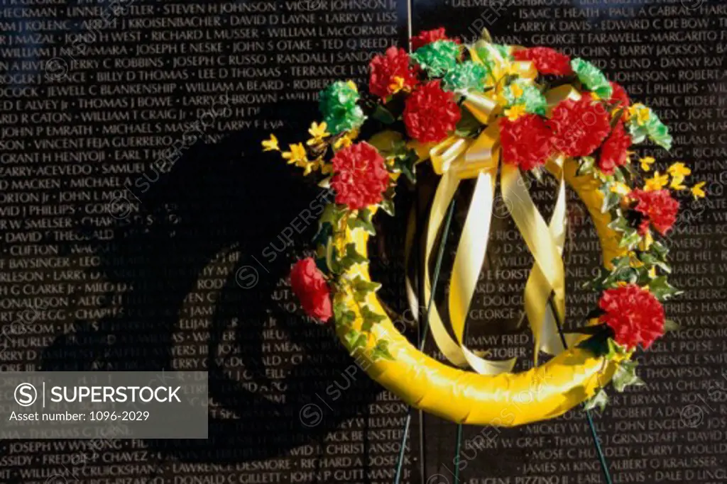 Wreath on the Vietnam Veterans Memorial Wall, Vietnam Veterans Memorial, Washington, D.C., USA