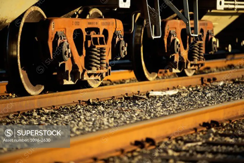 Close-up of train wheels on tracks