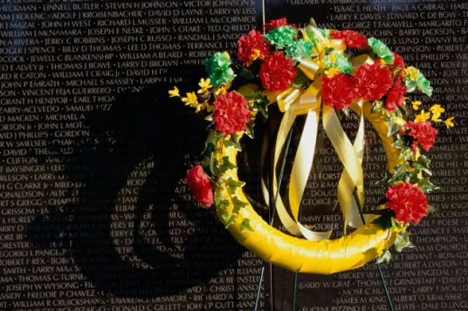 Wreath on the Vietnam Veterans Memorial Wall, Vietnam Veterans Memorial, Washington, D.C., USA