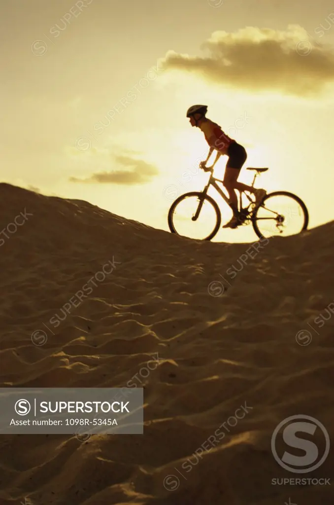 Side profile of a young woman cycling