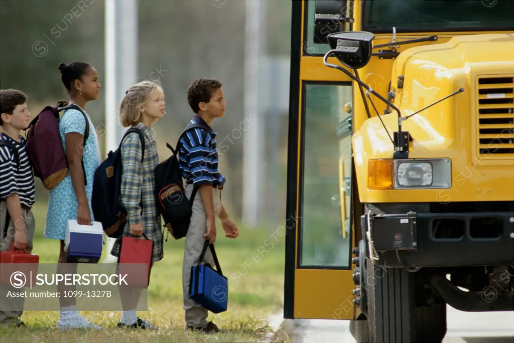 Children waiting in line for a school bus