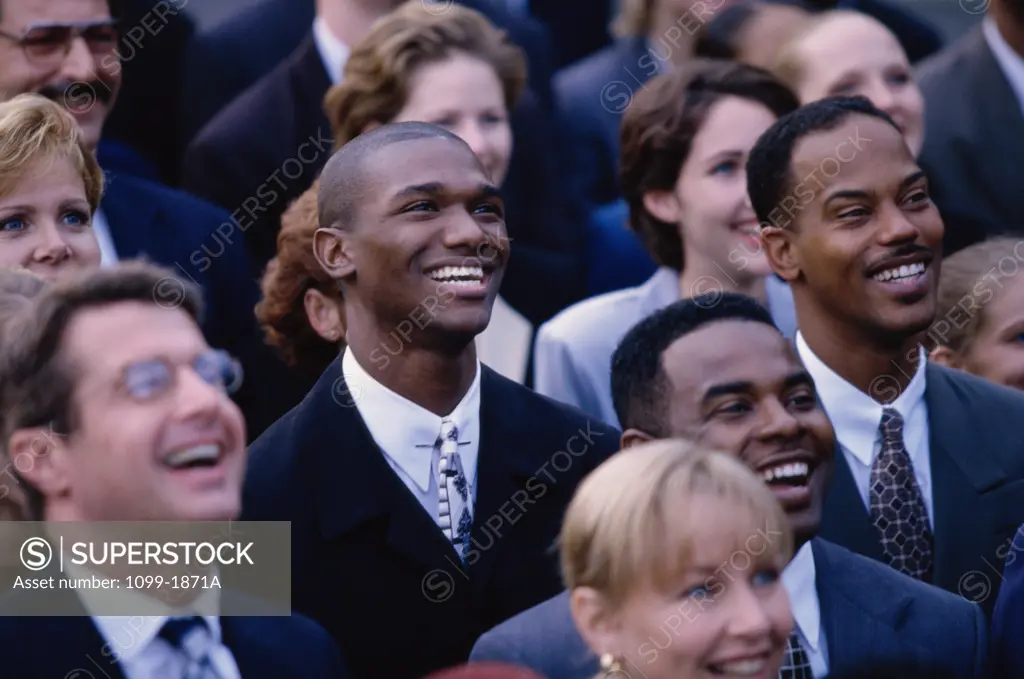 Crowd of business executives laughing