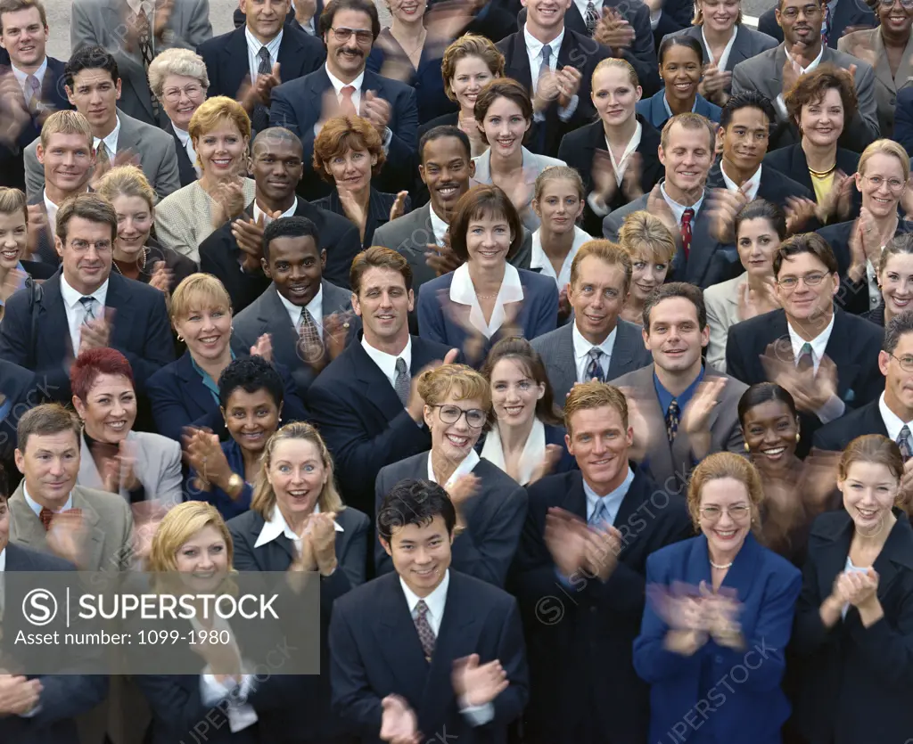 High angle view of a group of business executives clapping