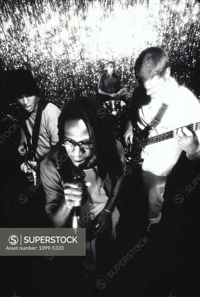 Young man singing into a microphone