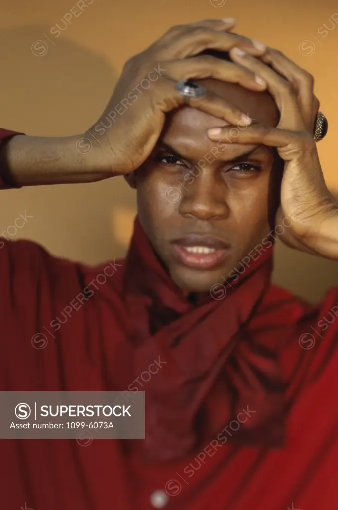 Portrait of a young man suffering from a headache