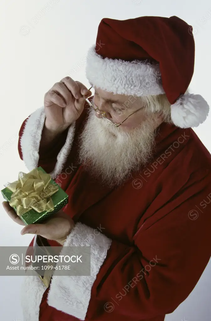 Santa Claus holding a gift