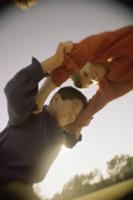 Low angle view of two boys fighting