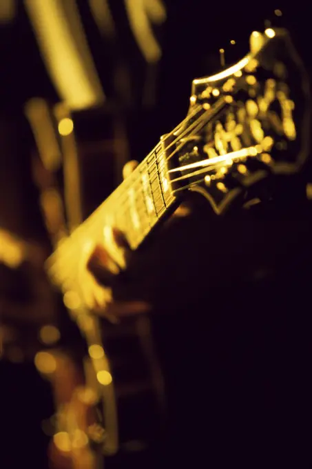 Close-up of a person playing an electric guitar