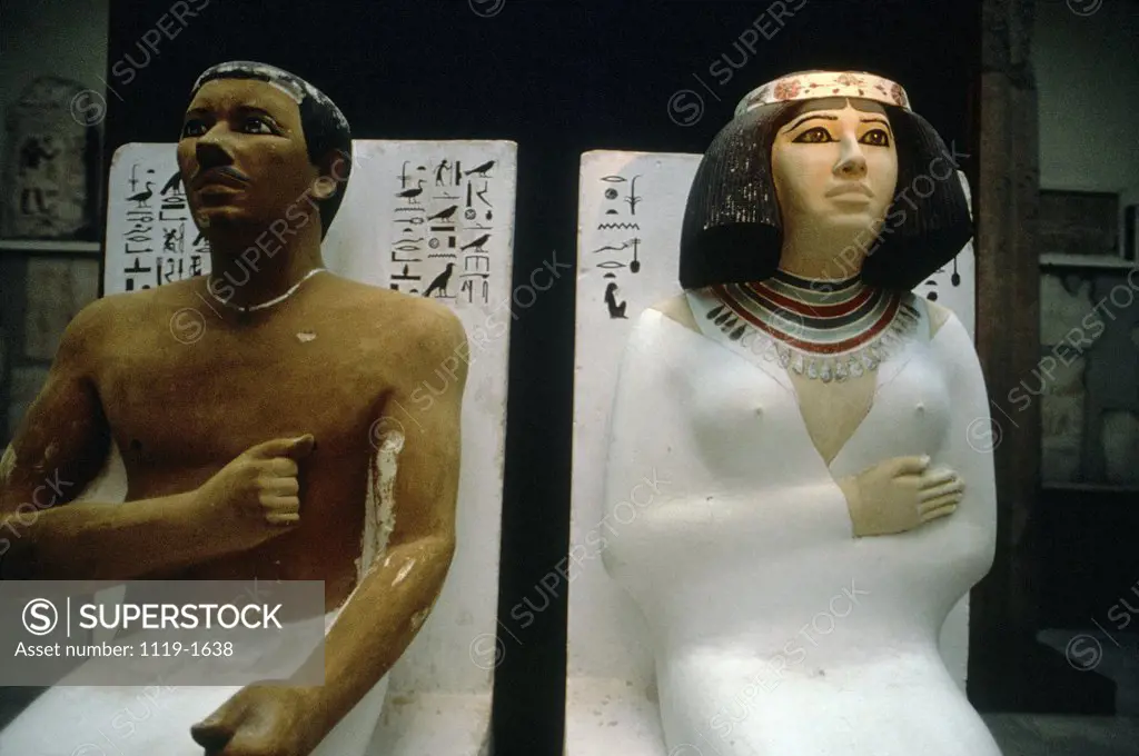 Close-up of two statues in a museum, Prince Rahotep, Princess Nofret, Egyptian Museum, Cairo, Egypt