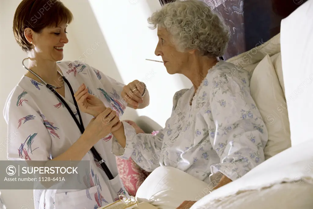 Female nurse examining a female patient