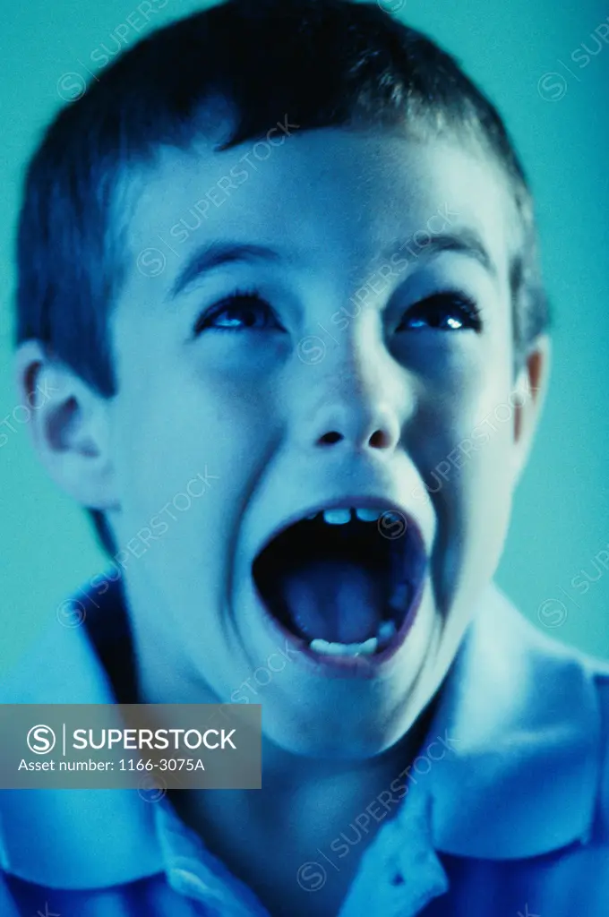 Close-up of a boy screaming