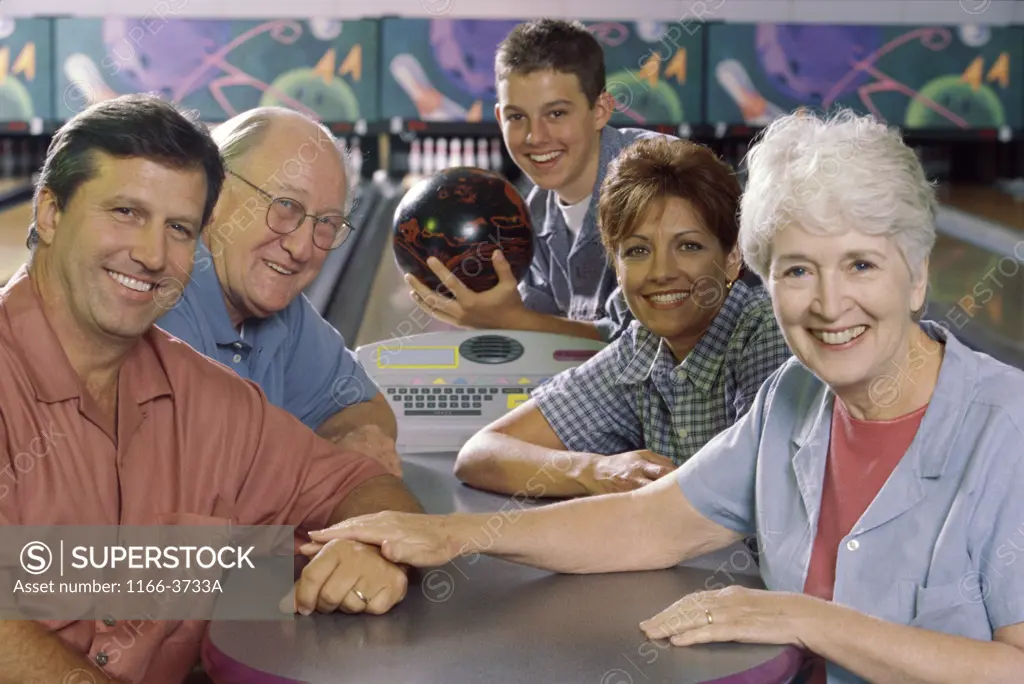 Portrait of a family at a bowling alley