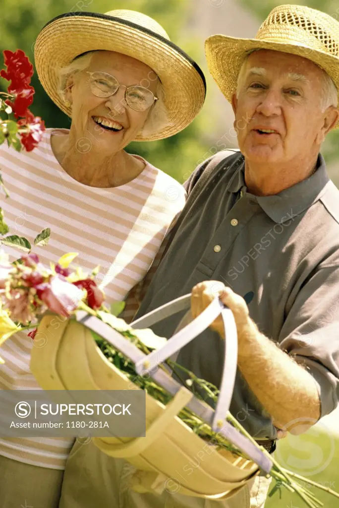 Portrait of senior couple gardening