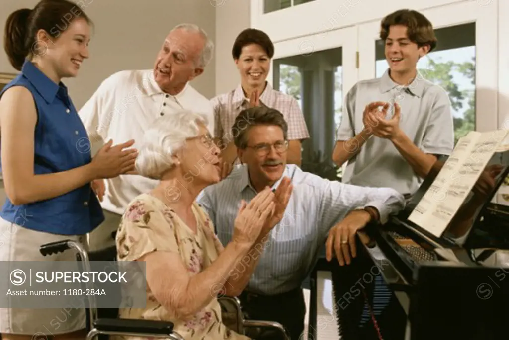 Family sitting around the piano singing