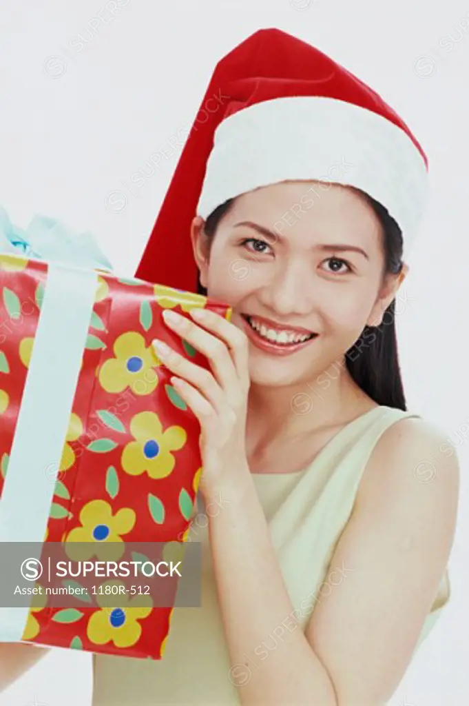 Young woman holding a gift