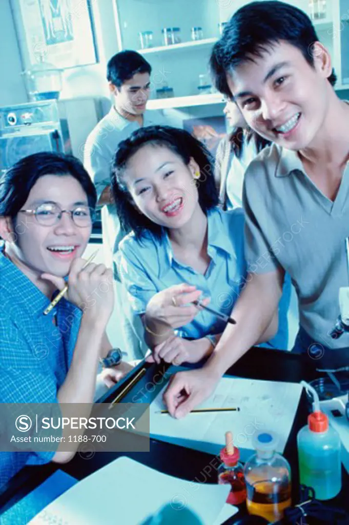 Portrait of high school students smiling in a laboratory