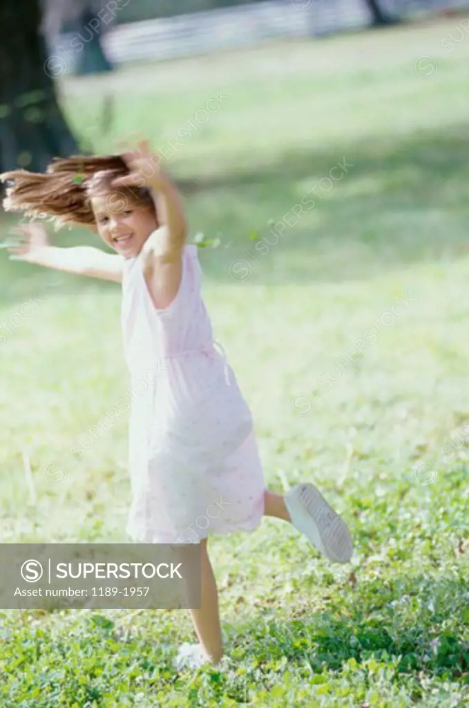 Side profile of a girl running in a park