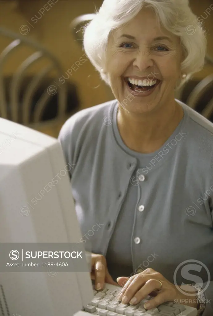 Portrait of a senior woman using a computer