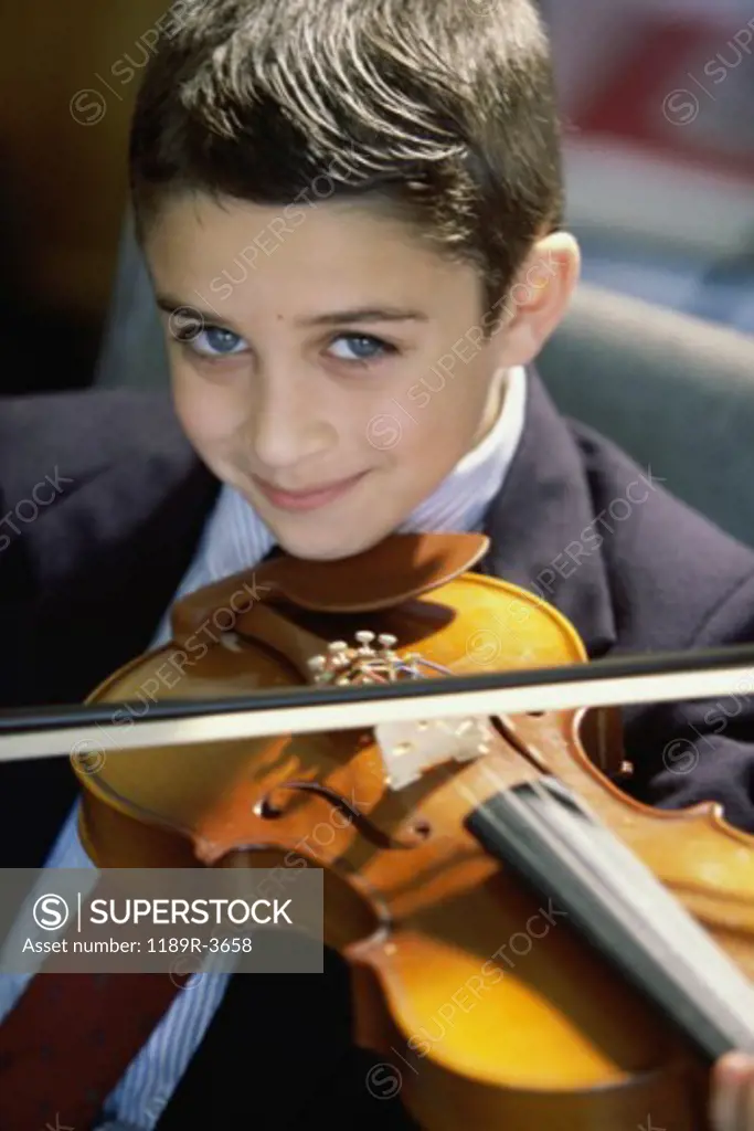 Portrait of a boy playing a violin